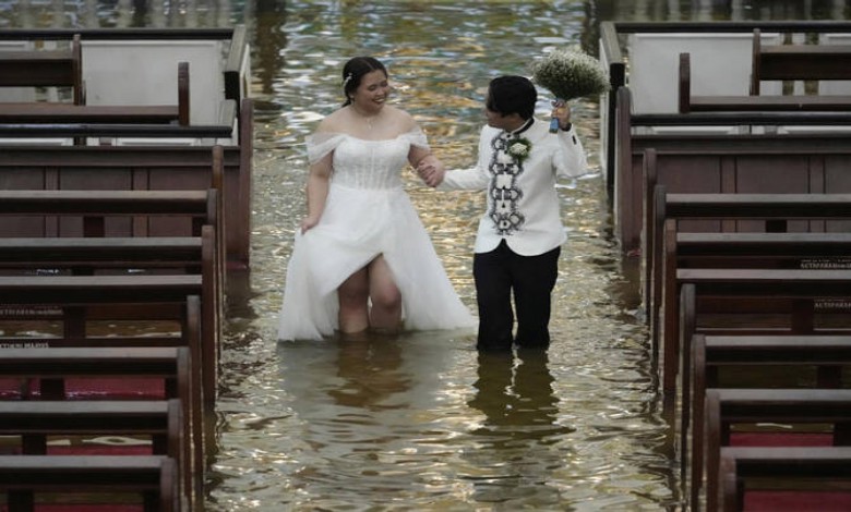 Couple walks down flooded aisle on their wedding day in Philippines